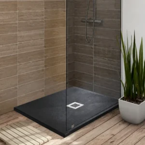 Kartell black stone effect 1400 x 900mm anti-slip shower tray with black stone effect finish, stone resin construction and rectangular shape.