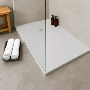 Kartell white stone effect 1600 x 700mm anti-slip shower tray with white finish, stone resin construction, rectangular shape and level access or floor mounted installation.