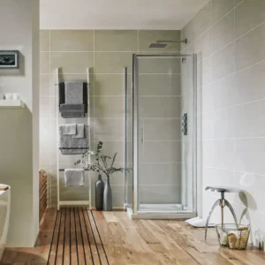 Scudo S6 700mm chrome frame 6mm pivot shower door with aluminium and glass construction, 6mm clear glass, chrome finish and wall mounted installation.